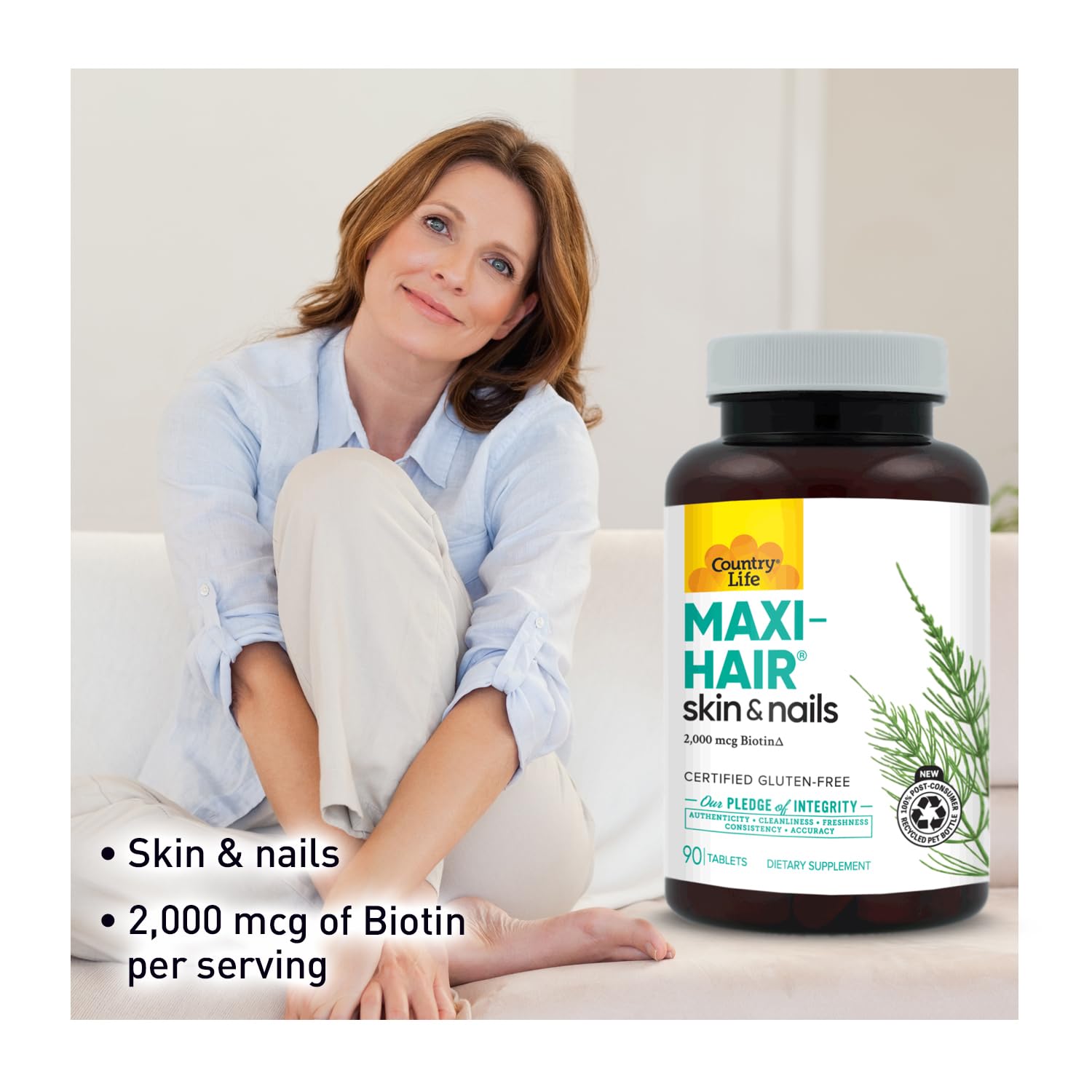 Country Life Maxi-Hair Biotin Supplement bottle with a measuring spoon