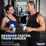 CREATURE Creatine Monohydrate Capsules with water glass