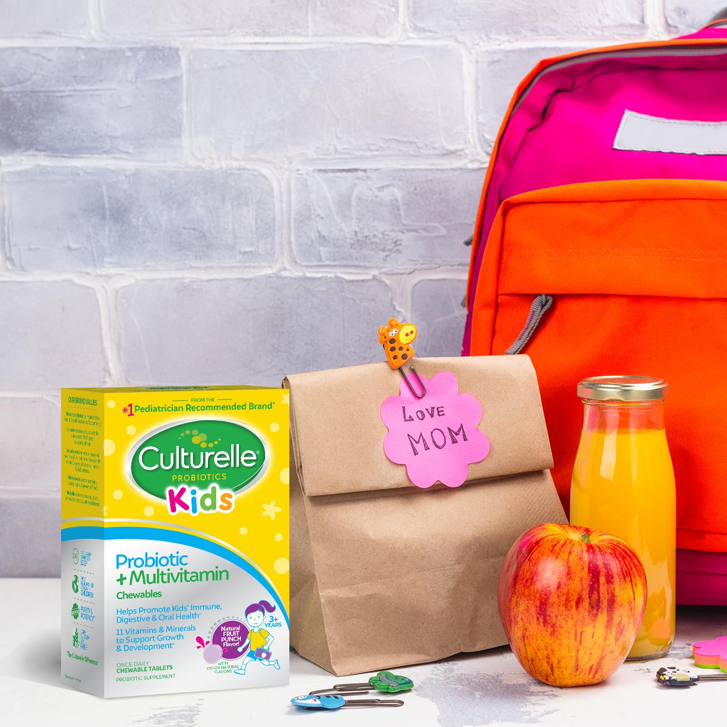 Culturelle Kids Probiotic + Complete Multivitamin Chewables in a child's hand