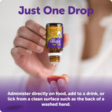 Ddrops support Liquid Vitamin D 600IU 5ml bottle on a wooden table
