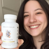 Dear Apothecary daily Wellness Herbal Supplement on a wooden table