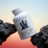 Dear Apothecary Magnesium Complex 500mg capsules on a wooden table