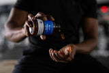 Designs for Sport Omega 3 HI-PO supplement on a wooden table