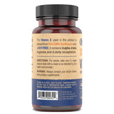 DEVA Vitamin E 400IU capsules on a wooden surface