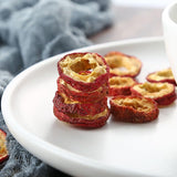 DIAN MAI HAO Hawthorn Slices alongside lotus leaf and chrysanthemum