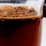 Divine Health MCT Oil Powder in a cup of coffee