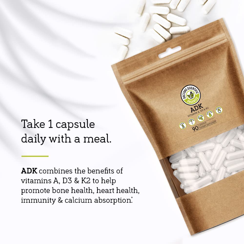 Doctors Scientific DSO ADK Vitamin Supplement capsules in hand