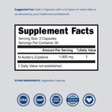 DORADO NUTRITION NAC Supplement 1000mg capsules on a wooden table