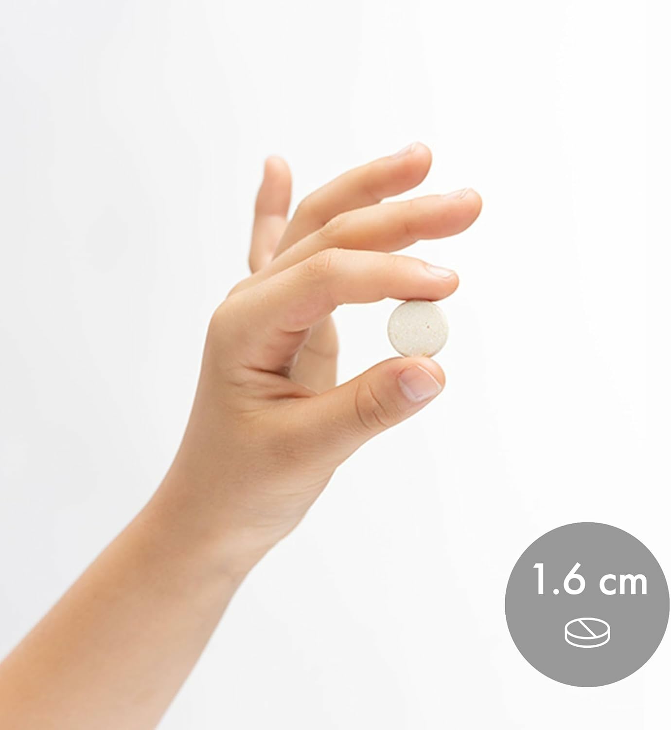 Dr. Mercola Chewable Multivitamin for Kids with a child's hand