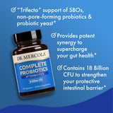 Dr. Mercola Complete Afterbiotics probiotic capsules on a wooden table