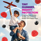 DR. MORITZ Elderberry Gummies in a child's hand