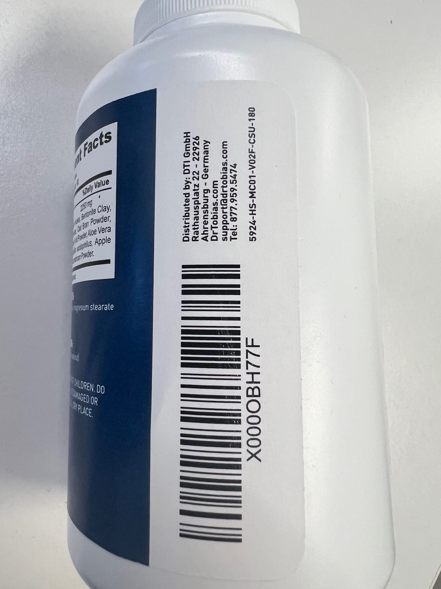 Dr. Tobias Psyllium Husk Capsules with a glass of water