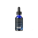 Dream Elements Liquid Sleep Drops 2oz bottle on a nightstand
