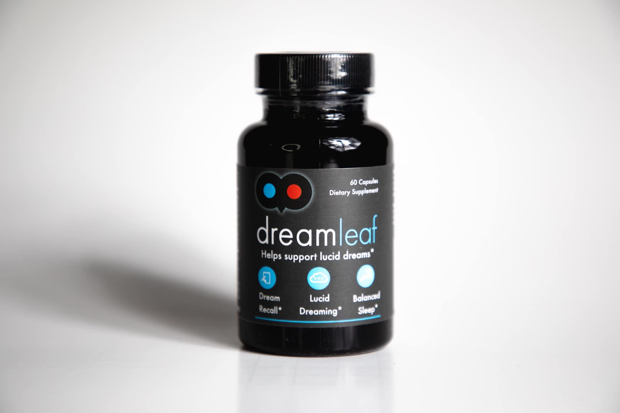 Dream Leaf Pro capsules on a wooden surface