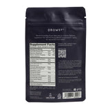 Drowsy Nighttime Sleep & Skin Supplement capsules on a wooden surface