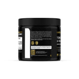 Earth Elixir Testosterone Support Supplement capsules next to a glass of water