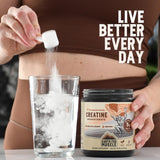 Earth Fed Muscle Creatine Monohydrate 322g with gym equipment