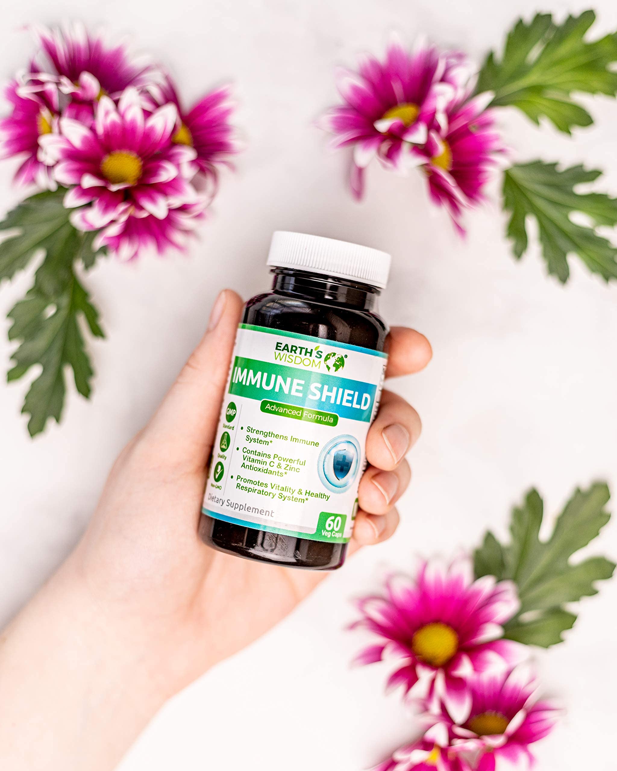 Earth's Wisdom Elderberry capsules in hand