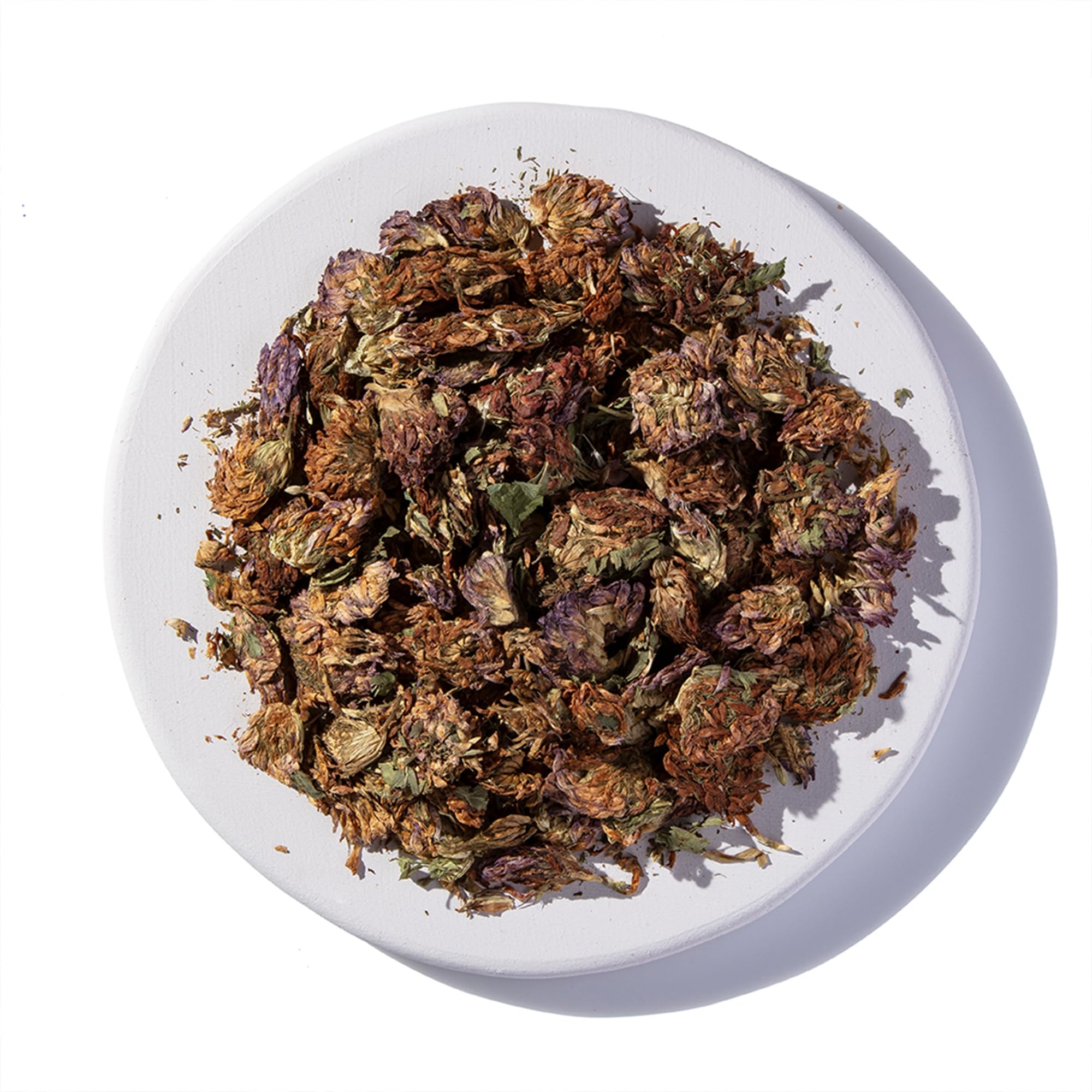 Earthborn Elements Red Clover Capsules on a wooden table