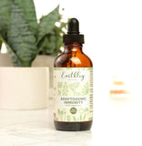 Earthley Wellness Adaptogenic daily wellness supplement opened with capsules