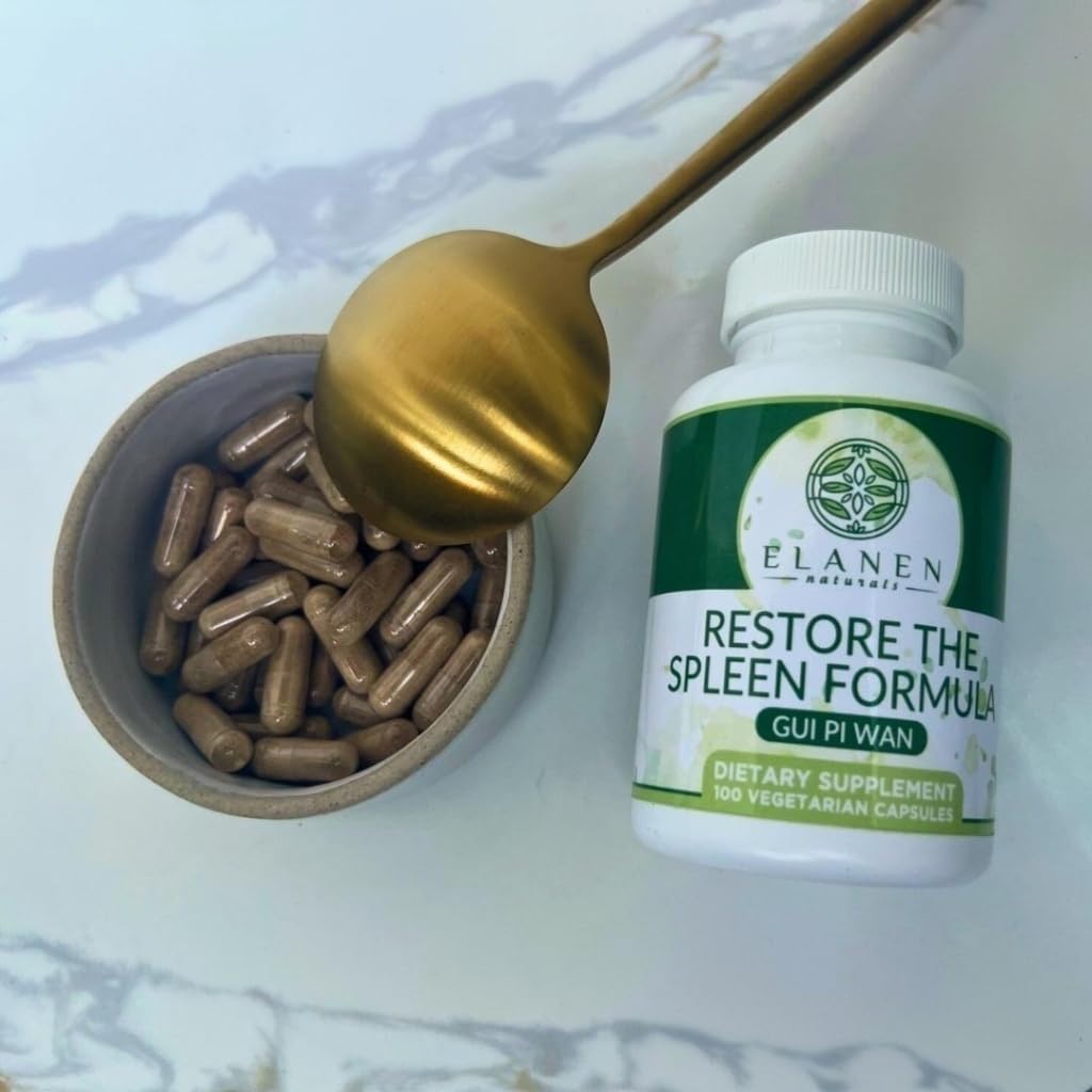 Elanen Naturals Gui Pi Wan capsules on a wooden surface