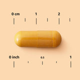 Elements Turmeric Complex capsules on a wooden surface