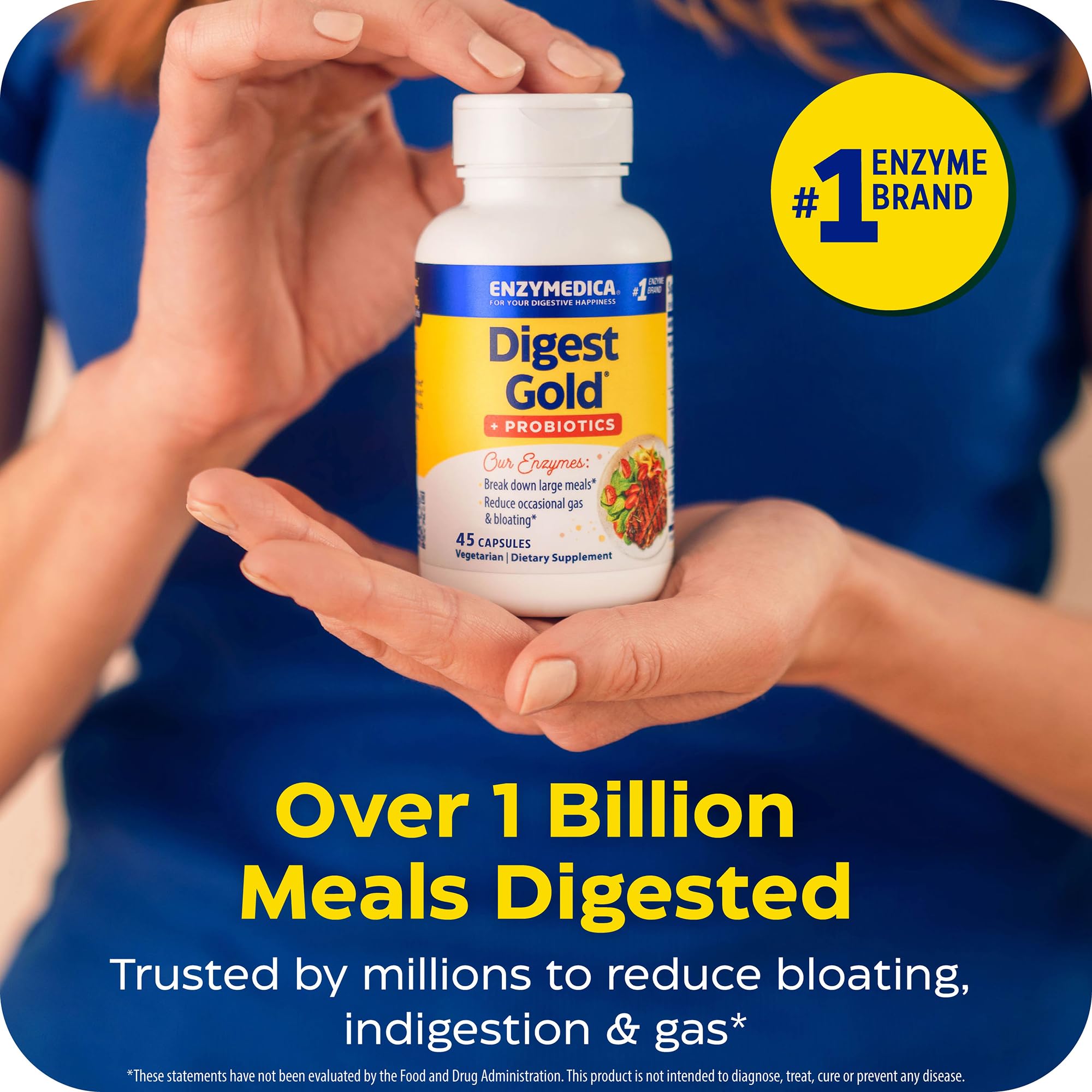 Enzymedica daily Gold + Probiotics capsules in a hand