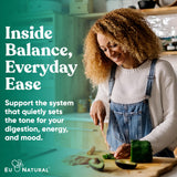 Eu Natural Probiotic Capsules for Women with a glass of water
