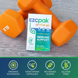 EZC Pak On The Go supplement with a glass of water