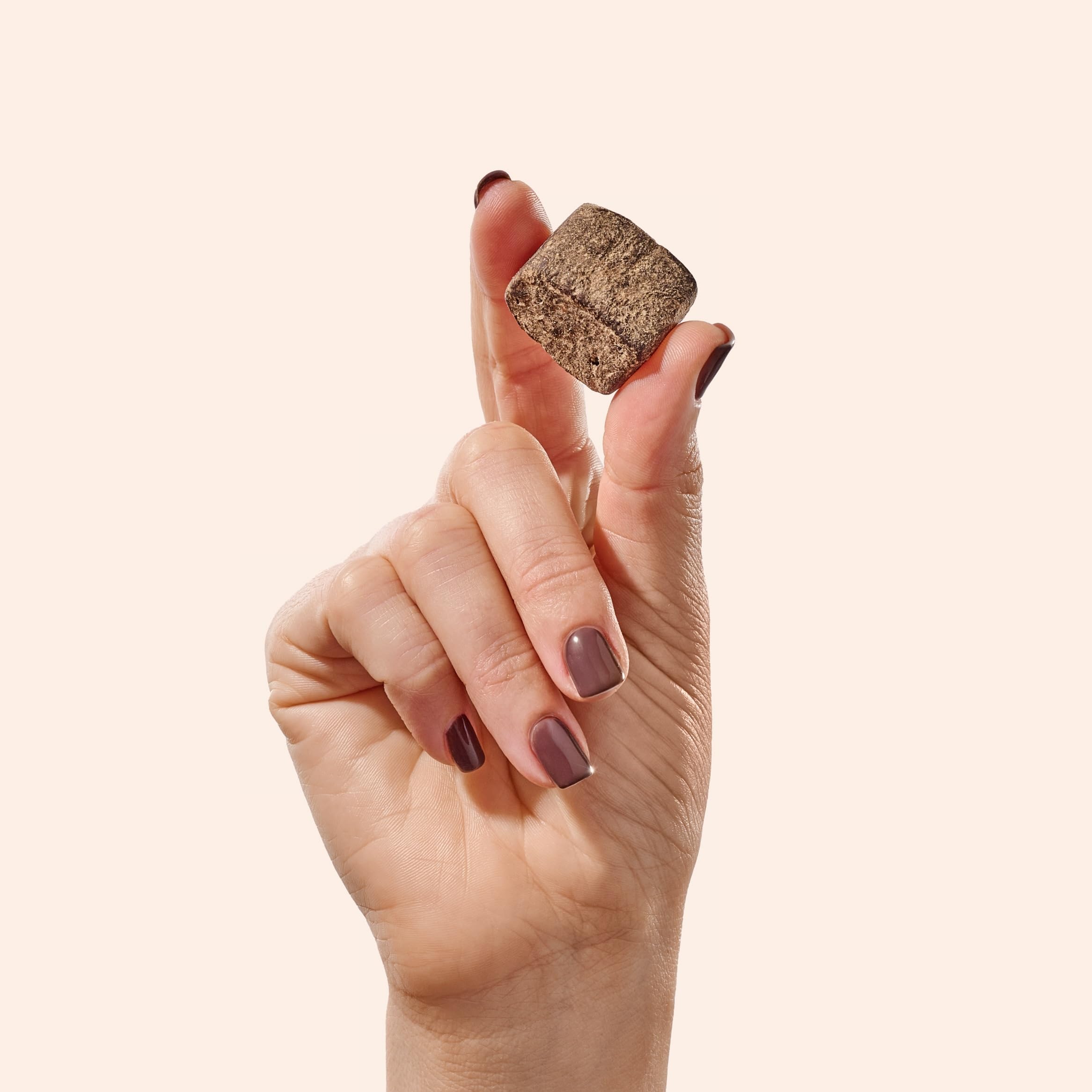 Fiome Dietary Fibre Supplement bites in a bowl with cocoa powder