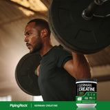 Fitness Labs Creatine Monohydrate powder on a gym bench