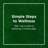 Flora Swedish Bitters in a glass of herbal tea