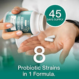 FloraBliss supplement capsules on a wooden surface