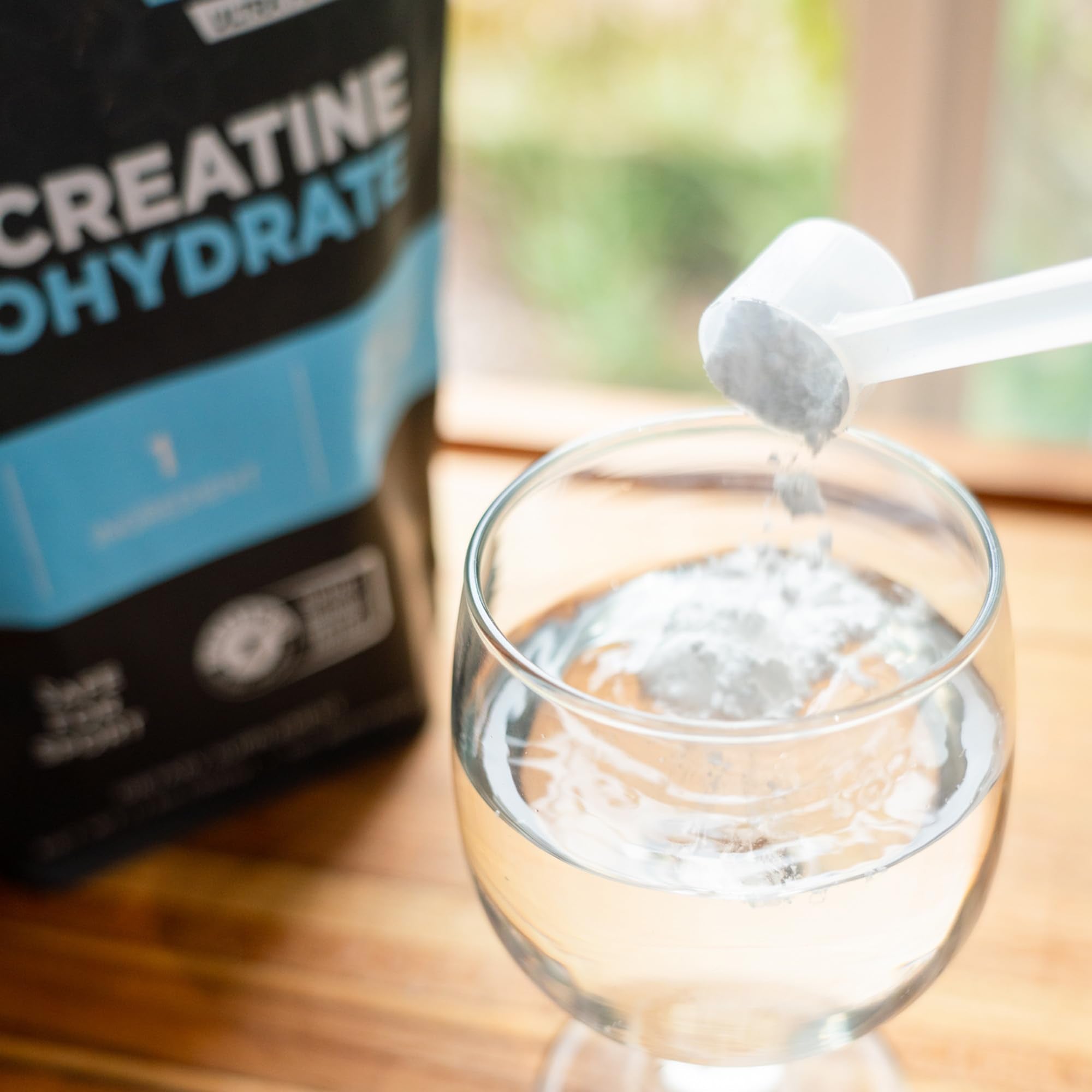 Fluid Creatine Monohydrate 100 servings unflavoured powder with measuring spoon