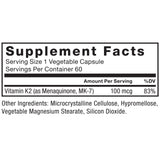 Force Factor MK-7 Vitamin K2 100mcg supplement on a wooden table