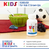 Forever Living Grape Chewable Multivitamins in a child's hand