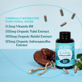 Four Sigmatic Calm Capsules lifestyle scene on a wooden table