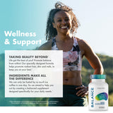 FoxyFit Essential Balance supplement with a glass of water