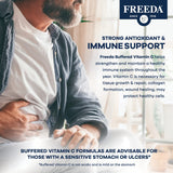 FREEDA Buffered Vitamin C 500mg capsules on a wooden table