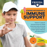 FREEDA Vitamin C Gummies for Kids in a bowl with fresh oranges