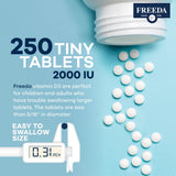FREEDA Vitamin D3 2000 IU tablets on a wooden table