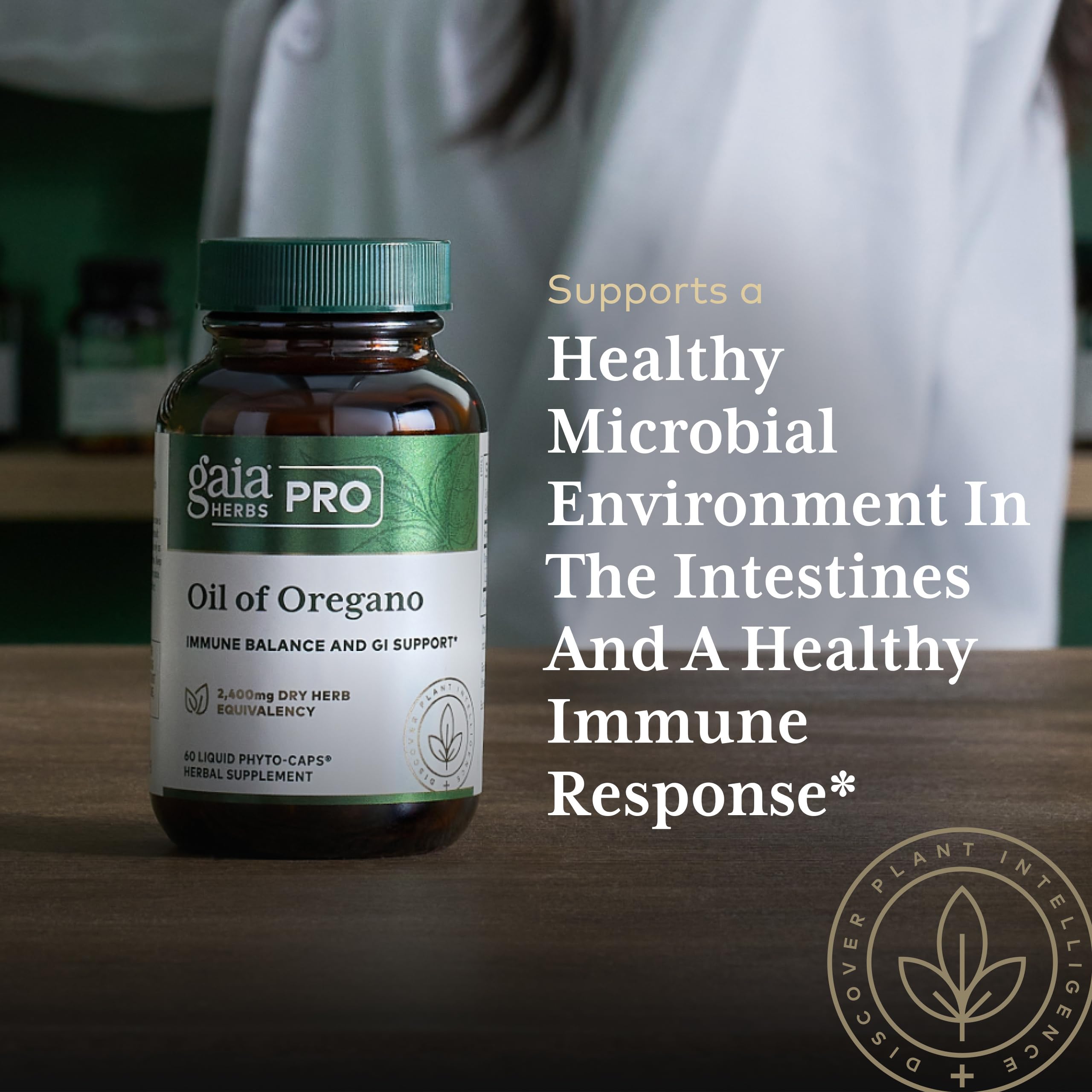 Gaia Herbs PRO Oil of Oregano 230mg supplement bottle with herbs background