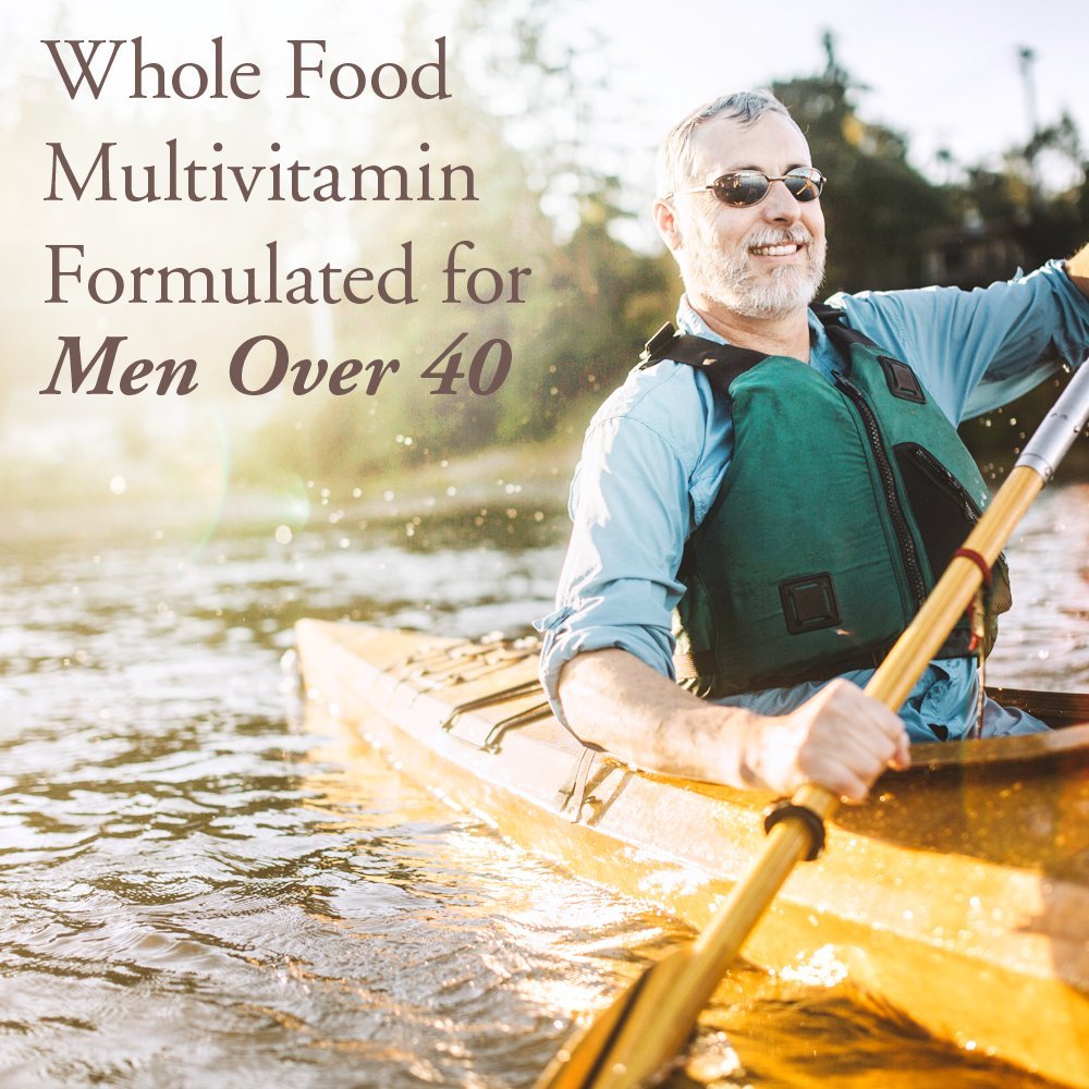 Garden of Life Men's Multivitamin 40+ tablets on a wooden surface