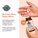 Garden of Life Once Daily Probiotic Supplement 30 Billion CFU with a glass of water