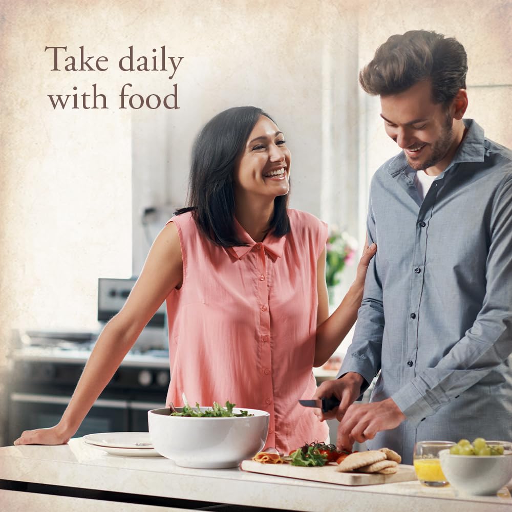 Garden of Life One Daily Women's Multivitamin tablet in hand