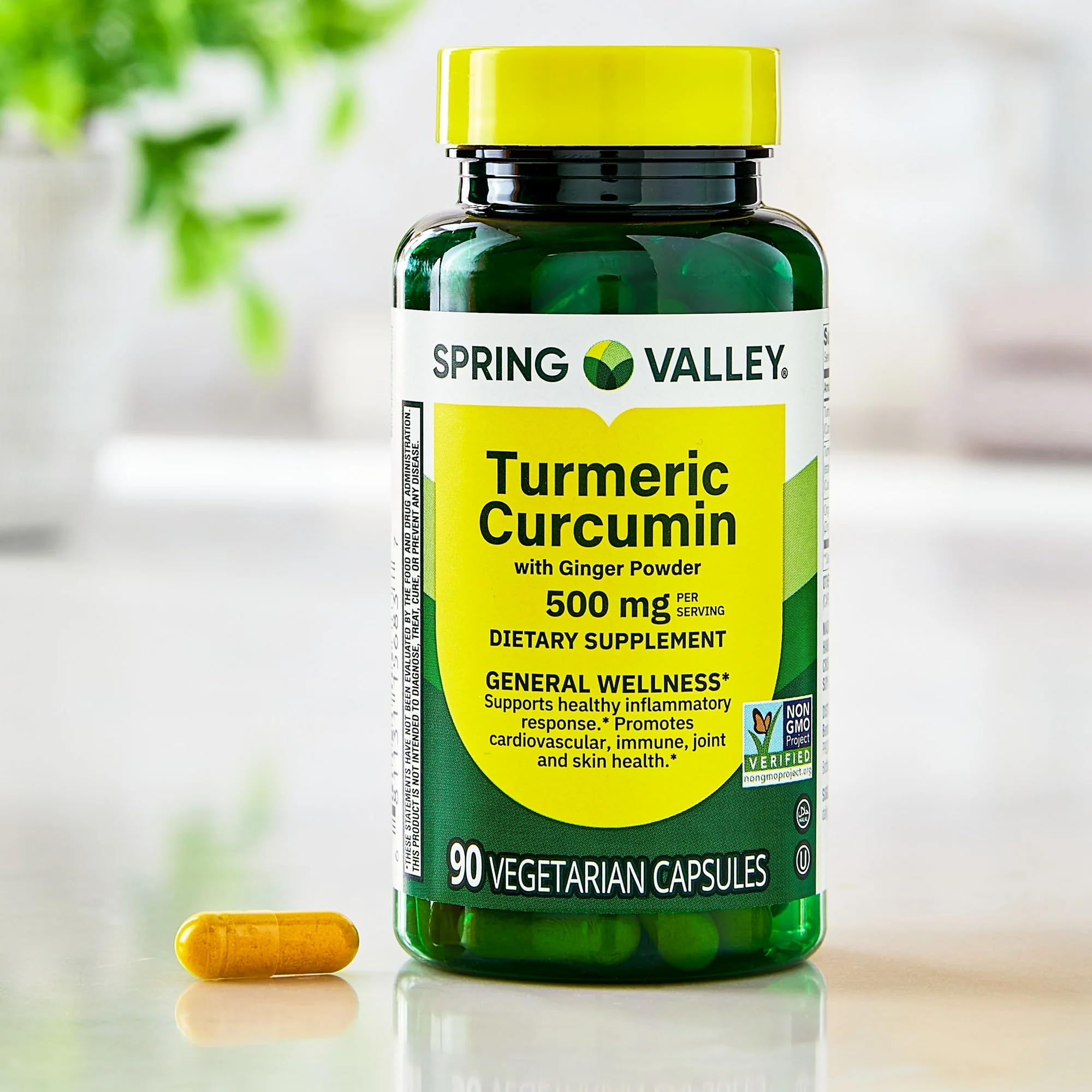 Generic Turmeric Curcumin with Ginger capsules with a measuring spoon