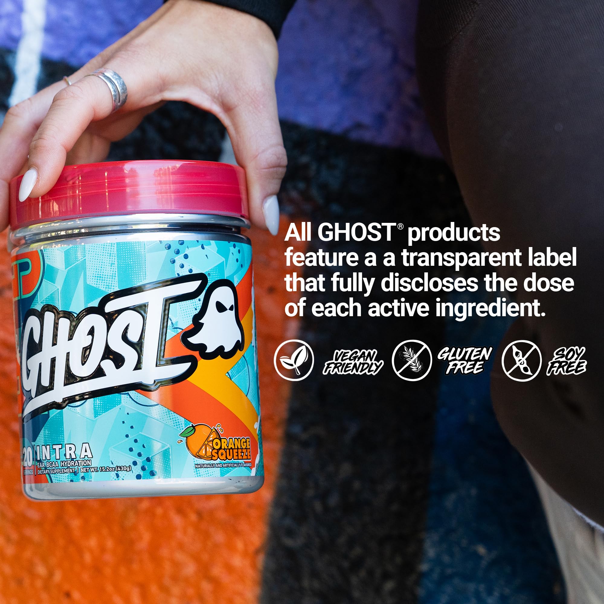 GHOST Intra BCAAs container with gym equipment in background