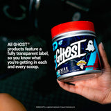 GHOST Size Creatine tub with a glass of mixed powder