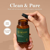 Global Healing Center Quercetin 250mg capsules with a measuring spoon