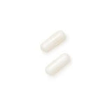 GNC Magnesium Supplement 120 Capsules on a wooden table